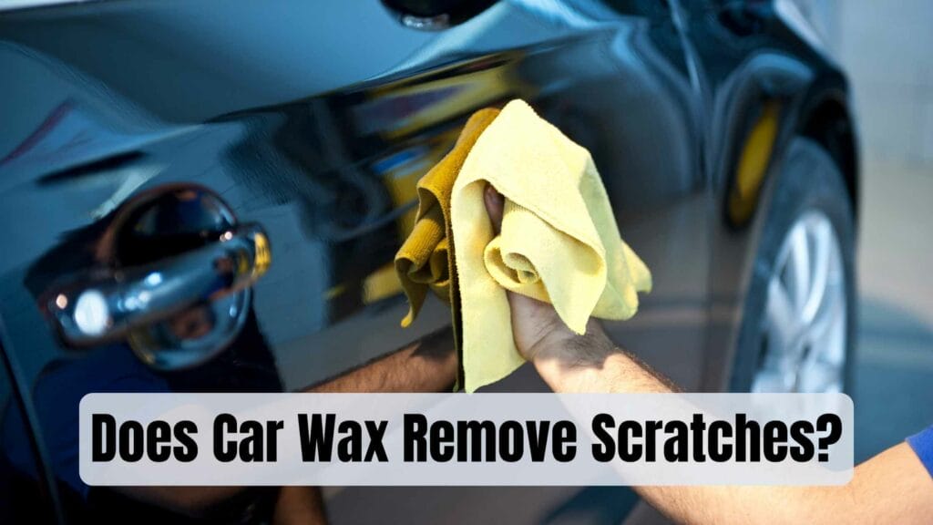 Photo of a person waxing a black car. Does Car Wax Remove Scratches?