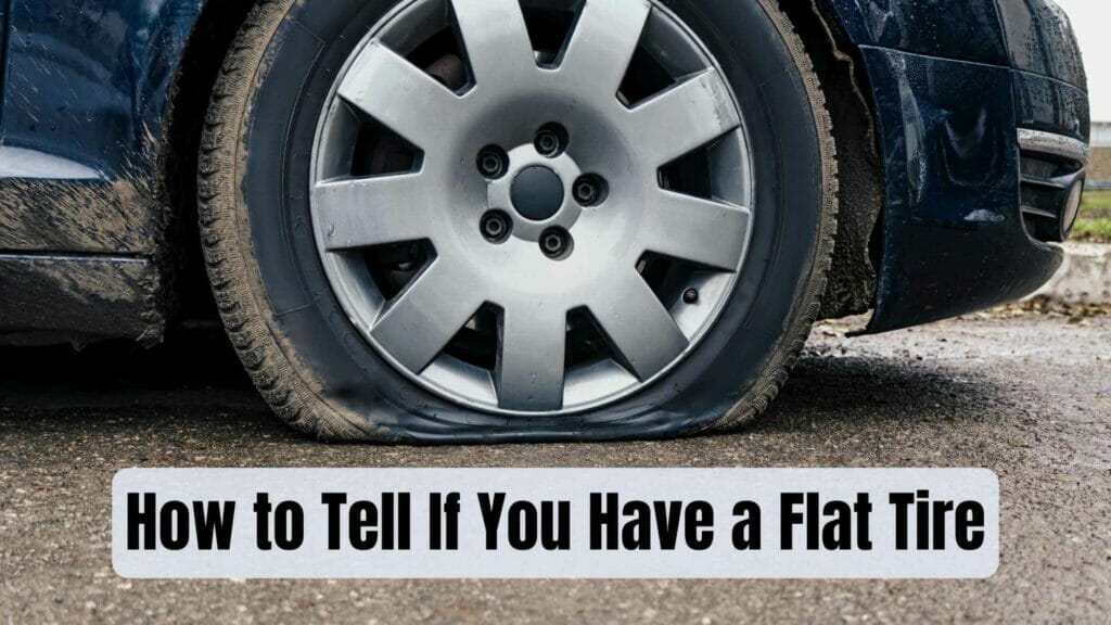 Photo of a car front wheel with a flat tire. How to Tell If You Have a Flat Tire.